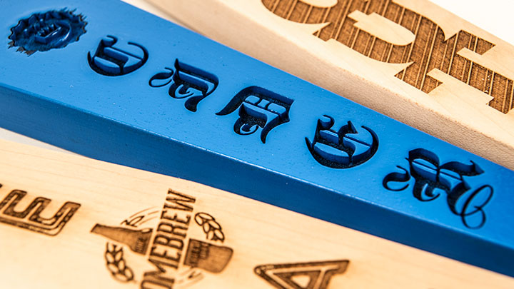 detail of engraved beer tap handles