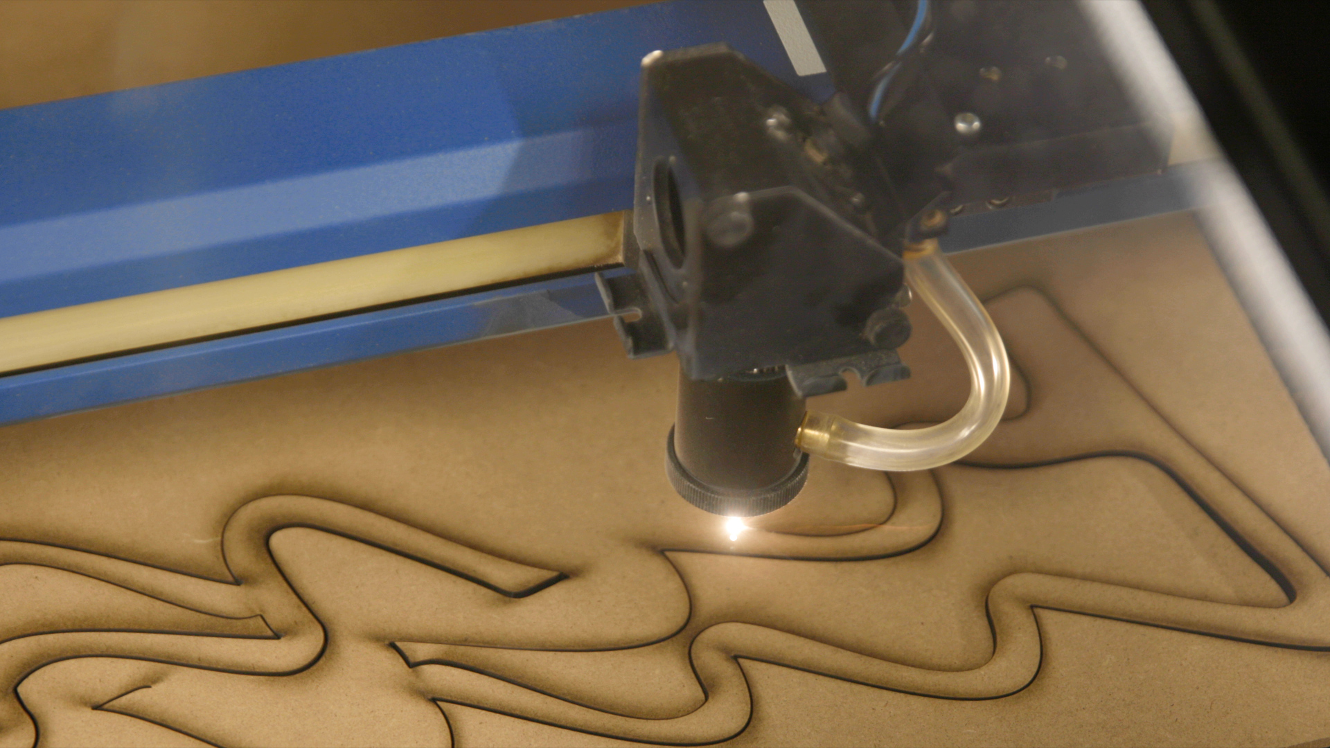 laser cutting a Christmas tree votive