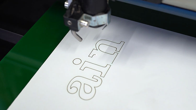cutting the lettering on paper layer