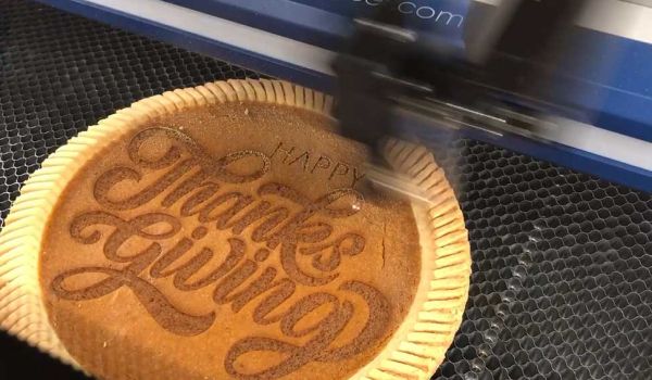 Happy thanksgiving message engraved pumpkin pie